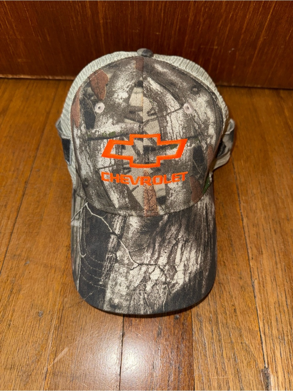 Men's Camo Trucker Cap with Orange Logo